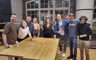 Members of the Roofr team pose at the company's offices