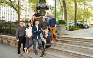 Giant Machines team members pose on the steps to a park in New York City