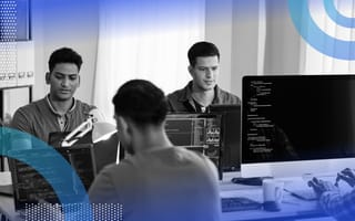 DevOps image of three men sitting at three different computers. They appear to be hard at work but working independently from one another.