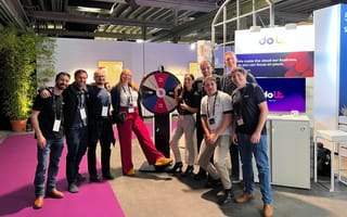 Doit International team members at an event with Doit branded materials