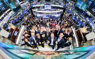 A panoramic photo of the Planet team members at a Nasdaq listing event.