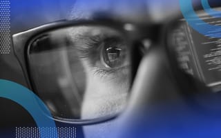 How Is Python Used in Machine Learning? Python for machine learning image of close-up on a man's eye. He wears glasses and his computer screen with code is reflected in his glasses.
