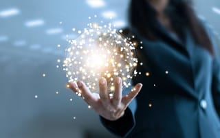 A business woman holding a globe of networking points.