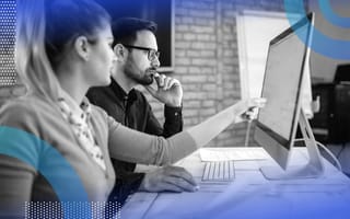 What Is TensorFlow? TensorFlow image of a man and a woman sitting in front of a computer screen together. He looks at the screen intently while she points to something on the screen.