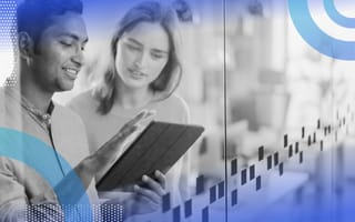 What Is Vue JS? Vue JS image of a man and a woman looking at a tablet together