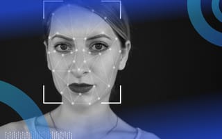 Deepfake image of a woman's face. She wears dark lipstick and we can see a kind of virtual net cast over her face and square brackets around her head.