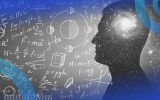 A silhouette of a human head with a light inside in front of a chalk board full of math