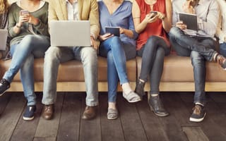 People consuming media on phones, tablets and laptops.