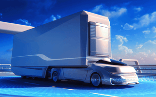 An autonomous truck driving across a bridge.