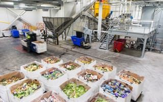 Several boxes of expired food are pictured inside Divert's anaerobic digestion facility in Freetown.