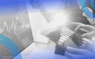 extrapolation image of a person's hands on a tablet looking at a graph. We also see a graph on their computer screen.