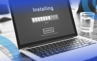 Freeware image of a laptop on a table. On the screen we see the word "Installing" and a progress bar.