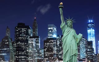 The Statue of Liberty with the NYC skyline in the background