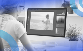Photoshop person editing image on desktop