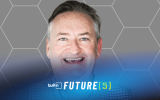 True founder and CEO Bret Cox poses for a photo against a gray pattern background.