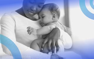A woman with an infant. Parental leave policies should be crafted carefully and inclusively.