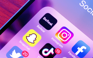 A mobile device displaying social media company apps.