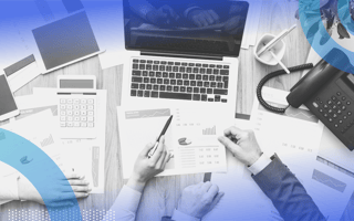 Cost Accounting People working in office setting with laptop and charts