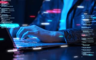 person programming on laptop