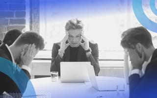 Executives at a desk thinking about crisis communications.