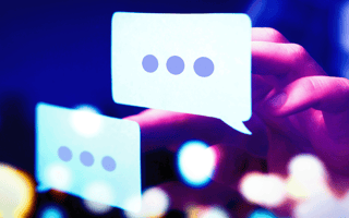 A person interacting with digital message bubbles.