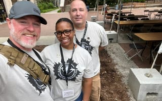 three employees volunteering at a bee corridor