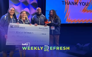 Reach Pathways holding a $4,000 check after wining the SXSW Pitch competition.
