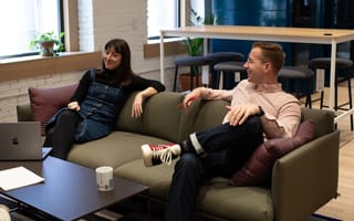 Contensquare team members lounging on couch in office