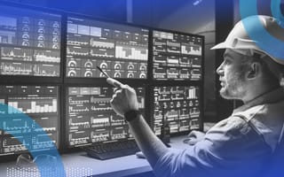 SCADA image of a person wearing a hardhat monitoring 6 computer screens full of incoming data.