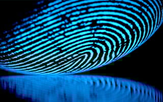 A close up of a finger print biometric scanner.