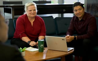 An image of Fisher Investments team members collaborating.