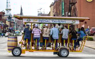 A Pedal Tavern party bike traverses the streets of Nashville.