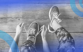 A person lacing on running shoes. Good game design can help people build healthy habits.