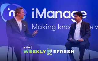 Howard Lewis (left), Microsoft's head of professional and business services, sits on stage with iManage CEO Neil Araujo (right).