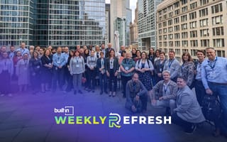 Members of the Fusion team pose for a group photo on rooftop patio.