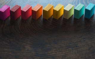 colored blocks aligned diagonally on a dark background