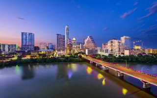 A nighttime photo of the Austin skyline.