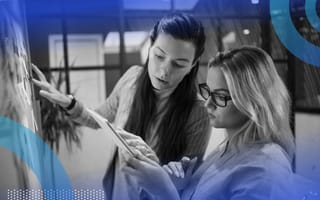 Two product managers working on product whiteboard