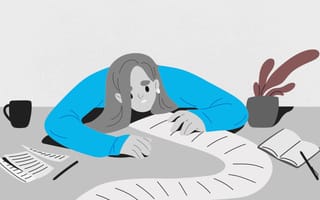 An illustration of an employee feeling sick with their head down on their desk.