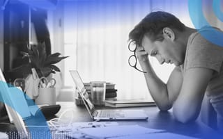 A man angrily removes his glasses due to stress