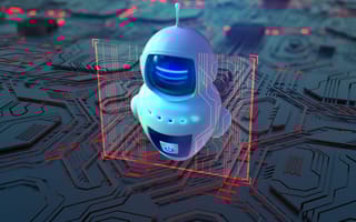 Small white robot against a technology background