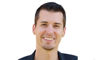 Kyle Hanslovan, CEO of Huntress, poses for a photo against a white background.