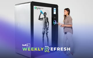 A person uses an Olyns recycling machine.