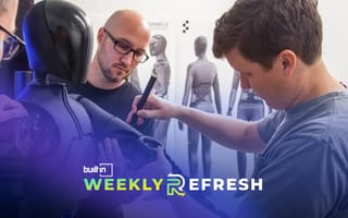 Figure team members work on a humanoid robot.