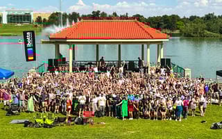 Large group photo in front of lake at Q3 2022 Ibotta picnic