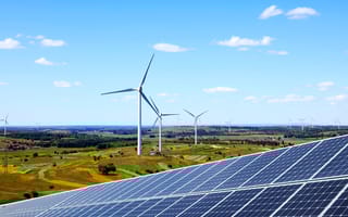 Solar panels and wind turbines generating clean energy.