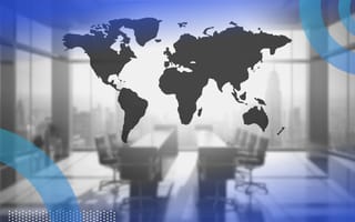 A map of the world and an office. Communication can help strengthen the bonds between offshore and U.S. engineering teams.