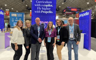 Members of the Propello team pose for a group photo at a convention.