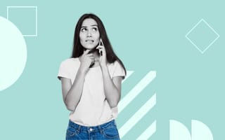22 Questions to Ask Before Accepting a Job Offer A woman talks on the phone in front of a green background.