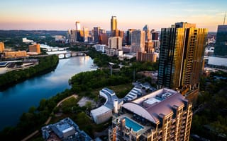 A view of downtown Austin from the river during sunrise.